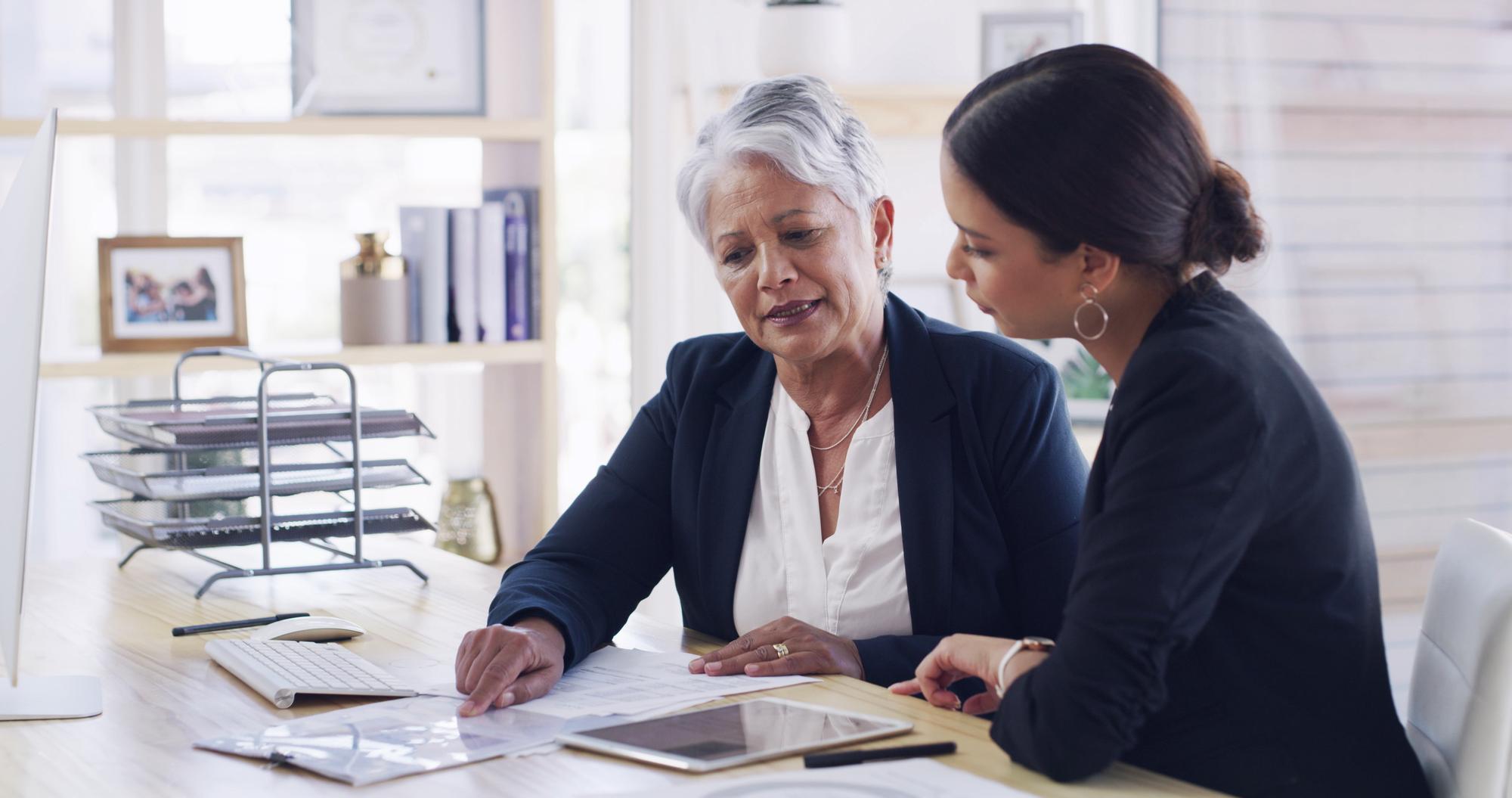Senior woman lawyer and document in office for planning debt settlement and legal guidance Elderly person attorney and reading paperwork for retirement fund asset protection and will information